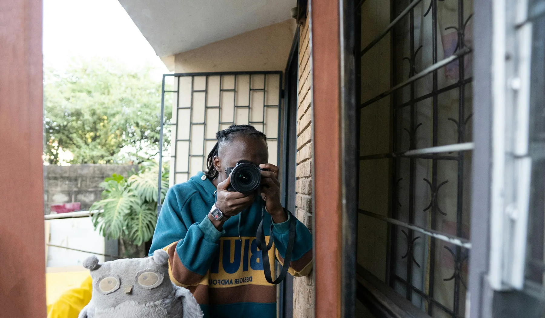 Photographer raising a camera in Nairobi, Kenya