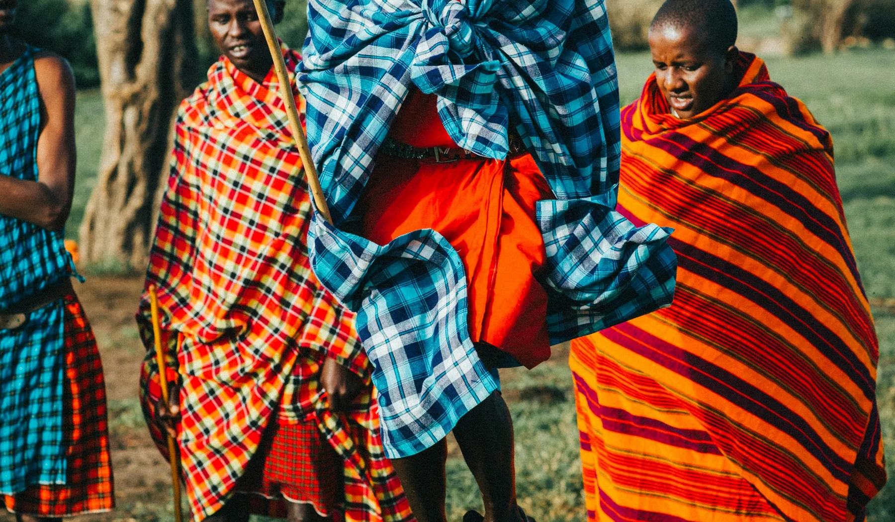 Maasai woman standing outdoors in traditional dress