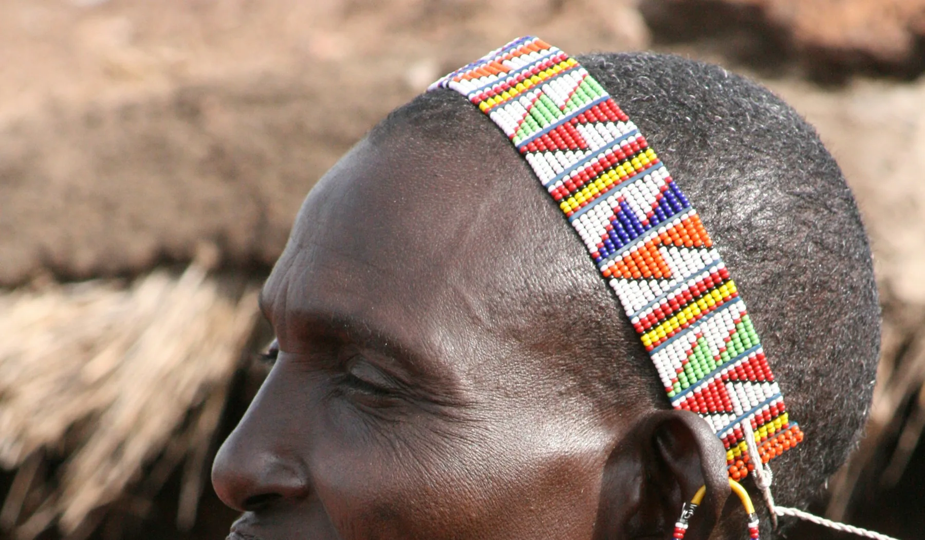 Maasai man wearing a narrow multicoloured beaded headband