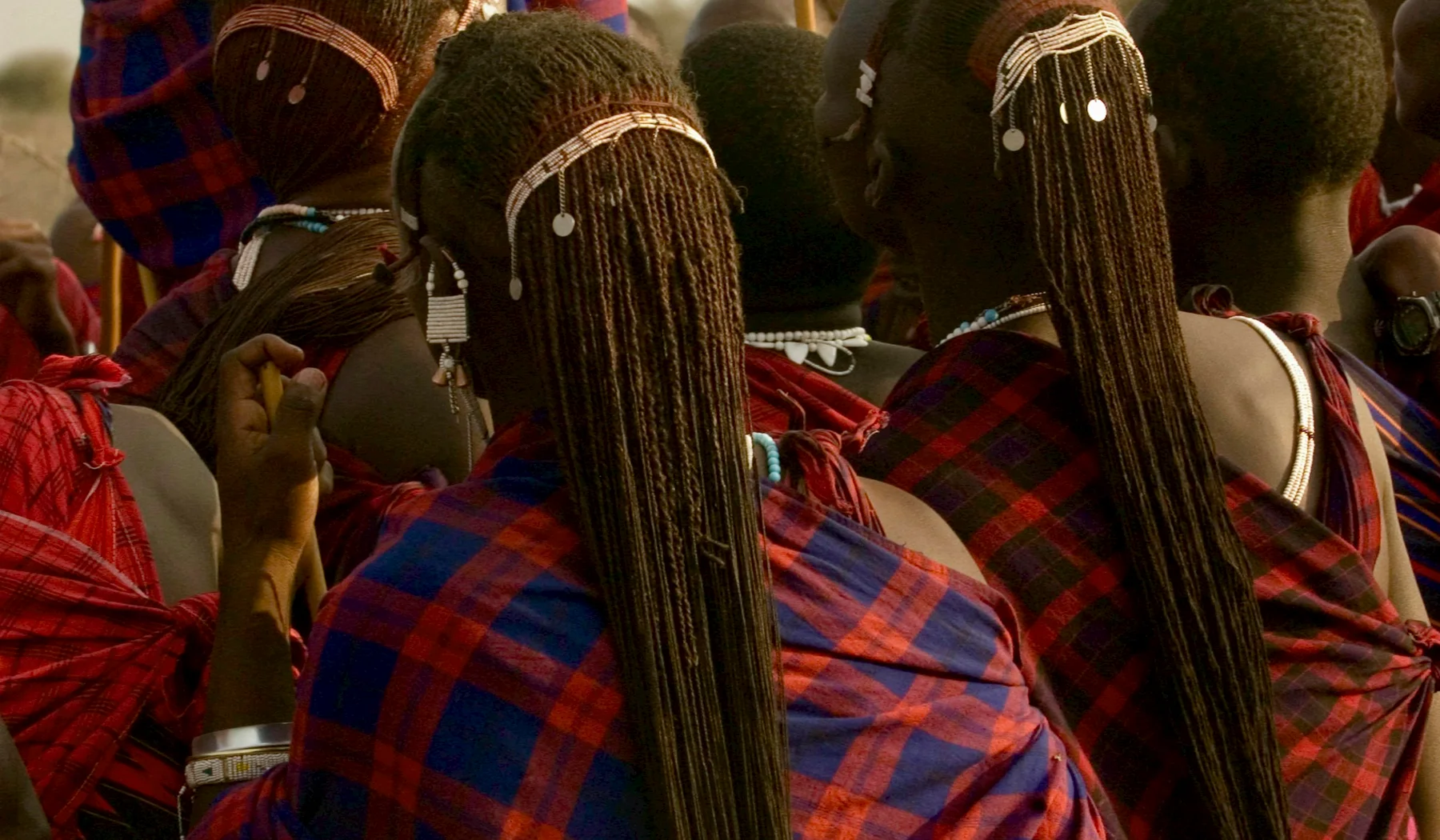 People wearing red and black checked cloth outdoors