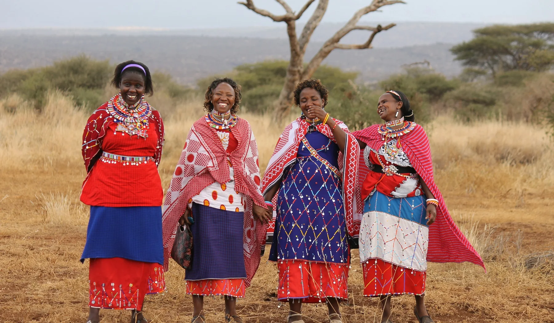 Group of Maasai women standing outdoors in Amboseli, Kenya