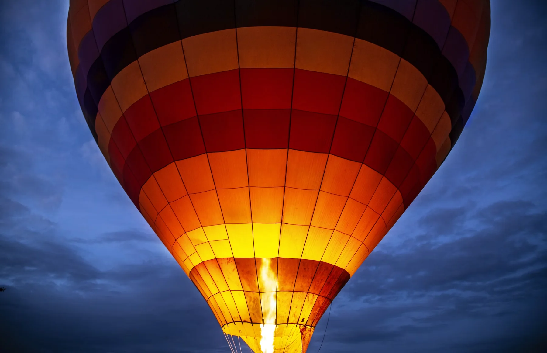 Hot-air balloon glowing as it is inflated before a safari flight