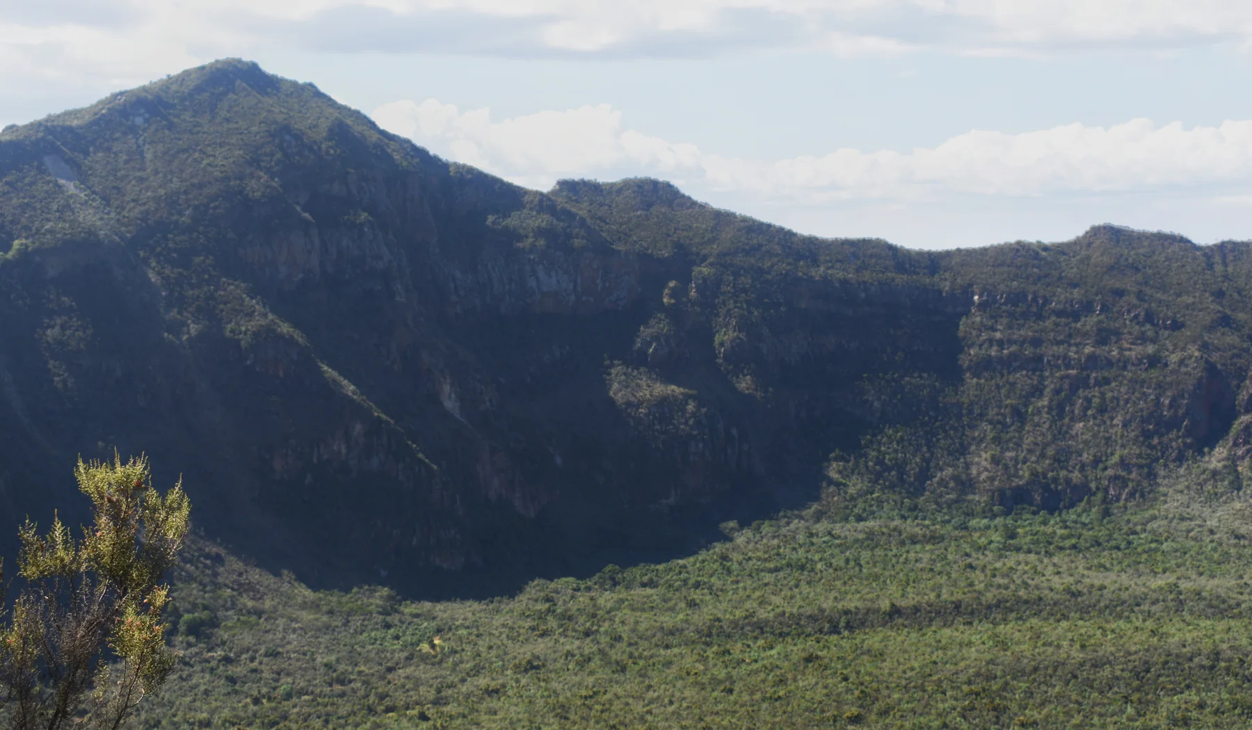 Deep green crater and rugged rim of Mount Longonot
