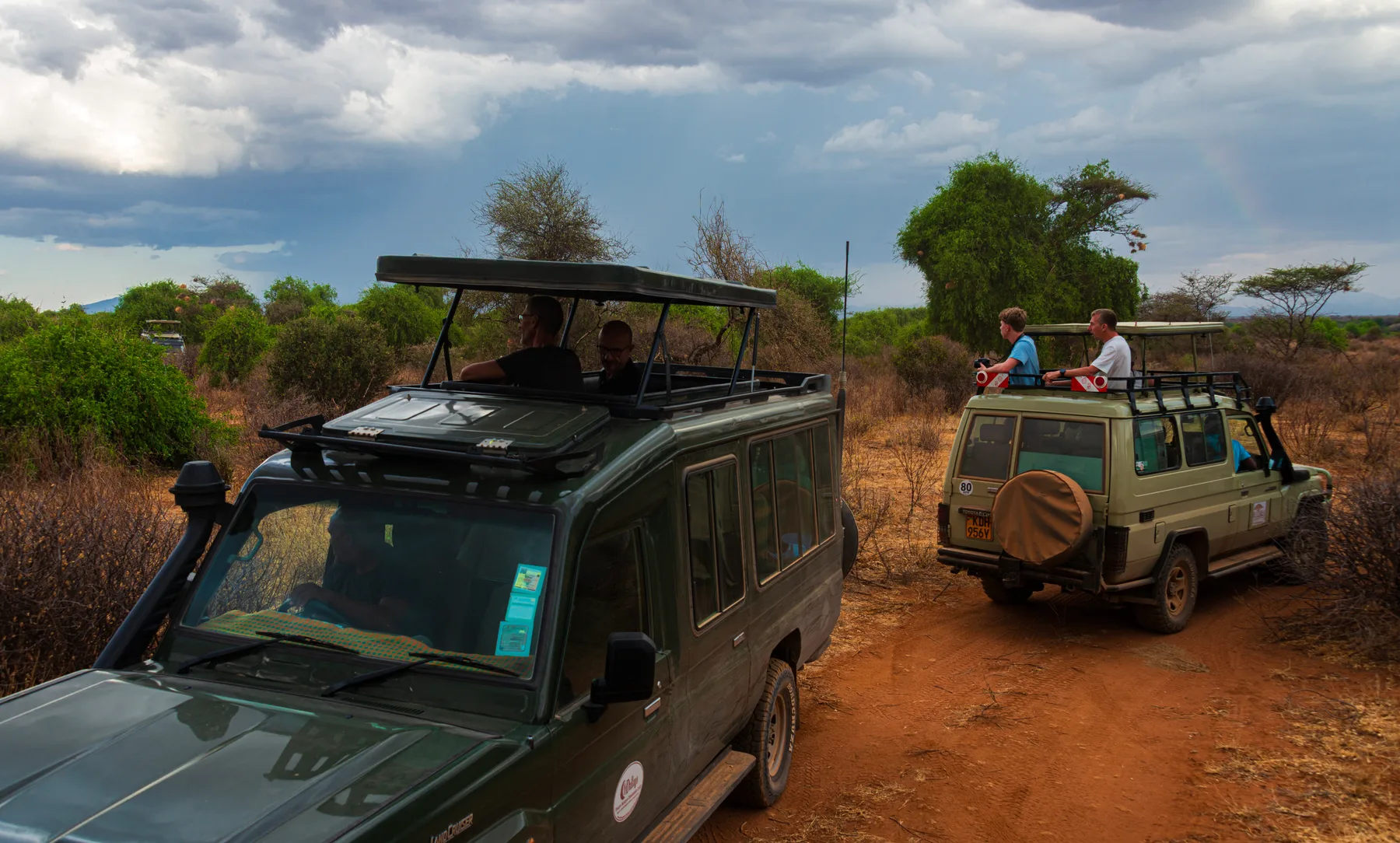 Two safari vehicles watching wildlife in Samburu National Reserve as rain approaches