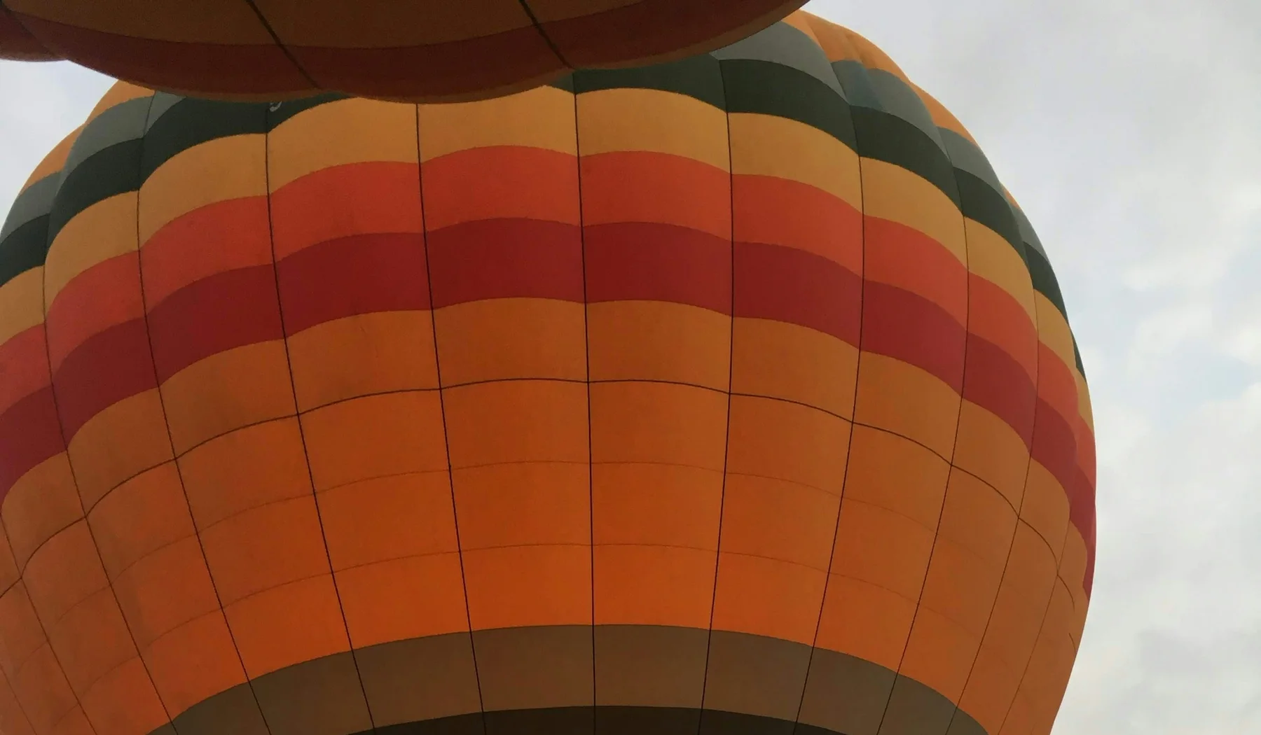 Close view of colourful balloon envelopes during launch preparation in the Maasai Mara