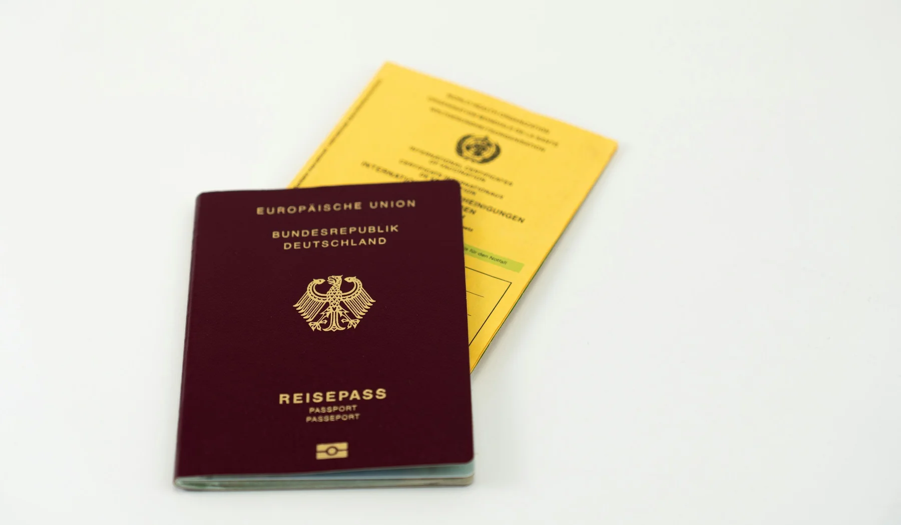 Passport beside an international vaccination certificate